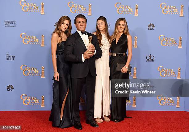 Actor Sylvester Stallone , winner of Best Supporting Performance in a Motion Picture for 'Creed,' poses in the press room with daughters Sistine,...