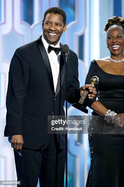 In this handout photo provided by NBCUniversal, Denzel Washington accepts with Cecil B. Demille Award during the 73rd Annual Golden Globe Awards at...