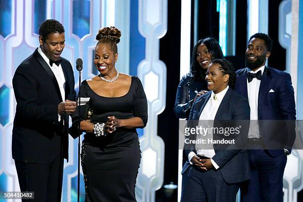 In this handout photo provided by NBCUniversal, Denzel Washington accepts with Cecil B. Demille Award with his family during the 73rd Annual Golden...