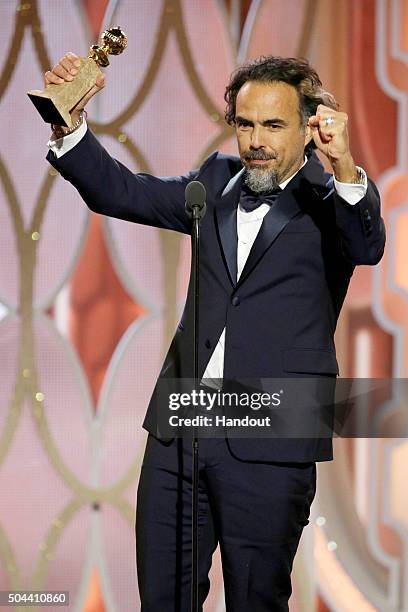 In this handout photo provided by NBCUniversal, Alejandro G. Inarritu accepts the award for Best Director - Motion Picture for "The Revenant" during...