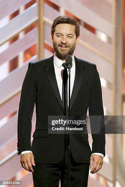 In this handout photo provided by NBCUniversal, Presenter Toby Maguire speaks onstage during the 73rd Annual Golden Globe Awards at The Beverly...