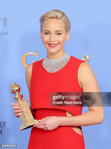 Actress Jennifer Lawrence, winner of Best Performance by an Actress in a Motion Picture - Musical or Comedy for "Joy," poses in the press room during...