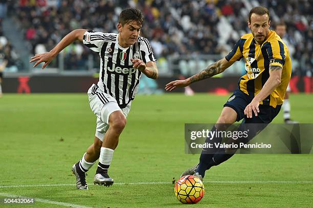 Paulo Dybala of Juventus FC in action against Evangelos Moras of Hellas Verona FC during the Serie A match between Juventus FC and Hellas Verona FC...