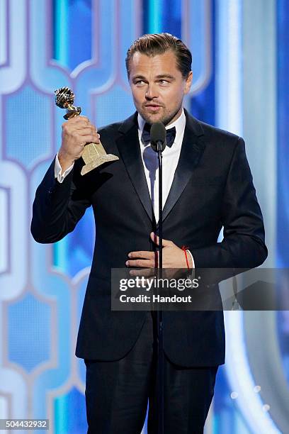 In this handout photo provided by NBCUniversal, Leonardo DiCaprio accepts the award for Best Actor - Motion Picture, Drama for "The Revenant" during...