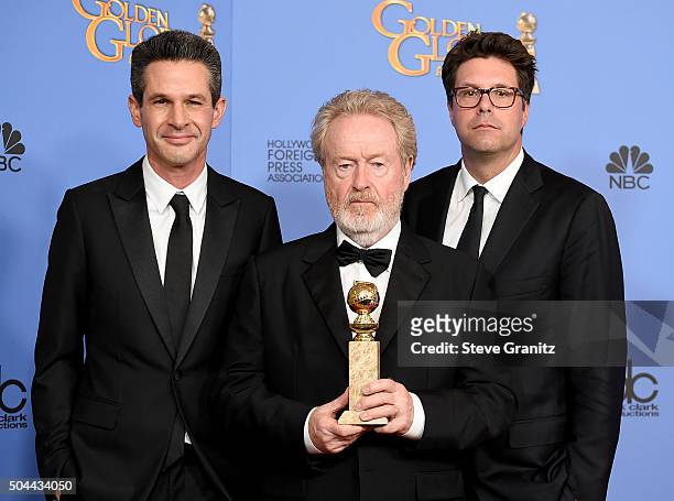 Producers Simon Kinberg, Ridley Scott and Michael Schaefer, winners of the award for Best Motion Picture - Musical or Comedy for "The Martian," pose...