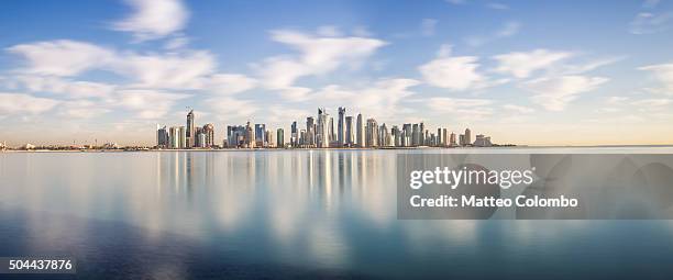 doha skyline panoramic at sunrise, qatar, middle east - doha view stock pictures, royalty-free photos & images