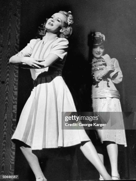Actress/dancer Betty Grable singing a duet w. Unident. Male actor & ensemble during Broadway production of new musical Du Barry Was a Lady.
