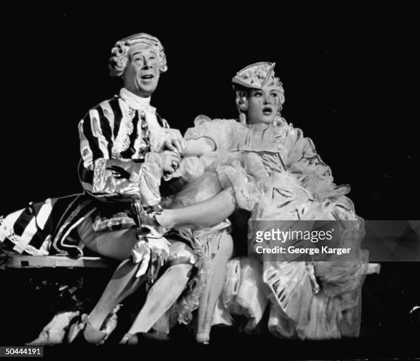 Actor Bert Lahr as Louis XV, rapsodizing over the lushousness of actress Betty Grable, as a Court of Versailles cortesan, after kissing her foot in...