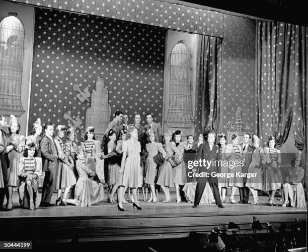 Actress Betty Grable in striped dress, w. Chorus ensemble, performing duet w. Undent. Male actor in the Broadway production of Cole Porter's new...