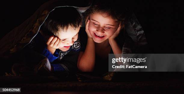 brother and sister movie night - kids fort stock pictures, royalty-free photos & images