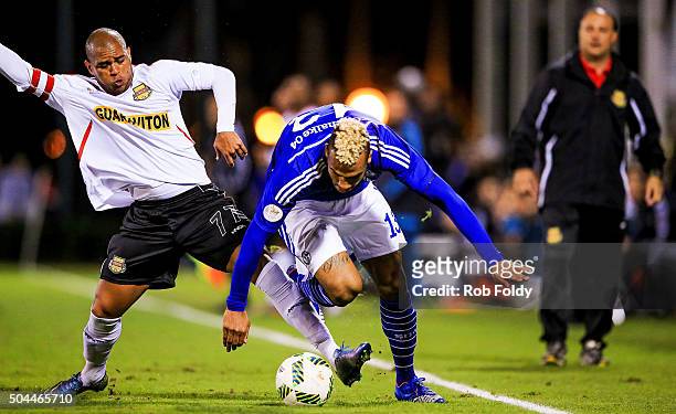 Maxim Choupo-Moting of FC Schalke 04 is defended by Gabriel Rodrigues dos Santos of the Fort Lauderdale Strikers during the match at the ESPN Wide...