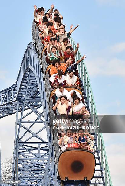 Twenty-year-old women wearing kimonos ride a rollercoaster after attending a "Coming-of-Age Day" celebration at the Toshimaen amusement park in Tokyo...