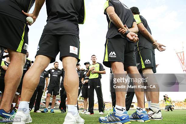 Thunder captain Michael Hussey speaks to his players before during the Big Bash League match between the Sydney Thunder and the Melbourne Renegades...
