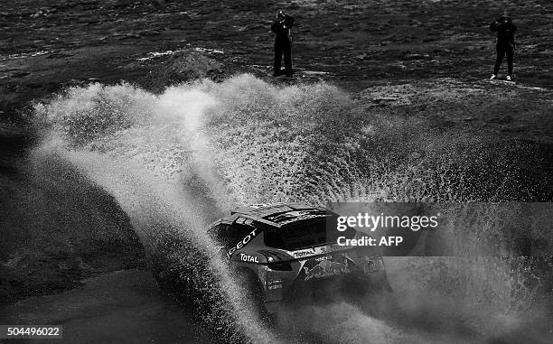 Peugeot's French driver Sebastien Loeb and co-driver Daniel Elena compete during the Stage 7 of the Dakar Rally 2016 from Uyuni, Bolivia to Salta,...