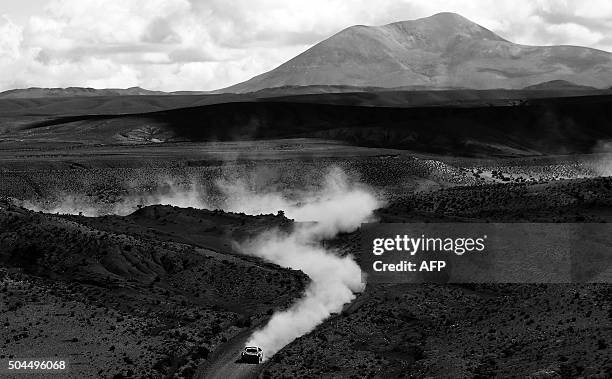 Peugeot's French driver Stephane Peterhansel and co-driver Jean Paul Cottret compete during the Stage 7 of the Dakar Rally 2016 from Uyuni, Bolivia...