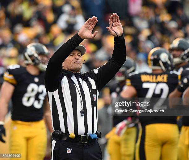 National Football League referee Ed Hochuli signals during a game between the Arizona Cardinals and Pittsburgh Steelers at Heinz Field on October 18,...