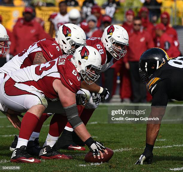 Center Lyle Sendlein, offensive guard Mike Iupati and offensive tackle Jared Veldheer of the Arizona Cardinals look on from the line of scrimmage...