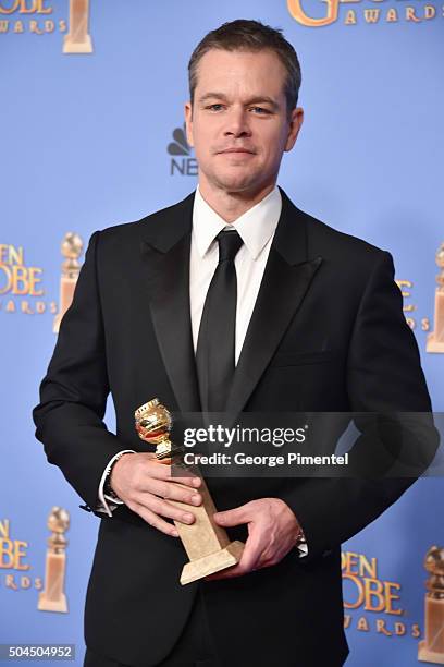 Actor Matt Damon, winner of the award for Best Performance by an Actor in a Motion Picture - Musical or Comedy for 'The Martian,' poses in the press...