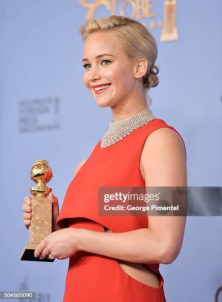 Actress Jennifer Lawrence, winner of the award for Best Performance by an Actress in a Motion Picture - Musical or Comedy for 'Joy,' poses in the...