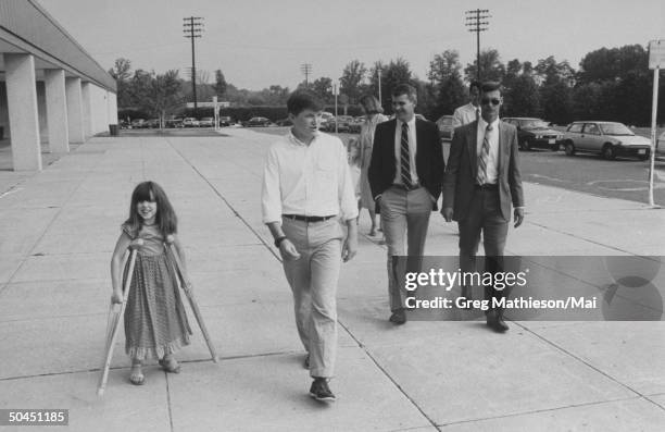 Lt. Col. Oliver North with son Stuart and daughter Dornin , on crutches recovering from a trampoline mishap.