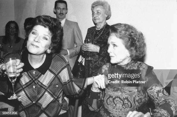 Actress Polly Bergen sitting and talking with Myrna Loy for whom tribute is being thrown.