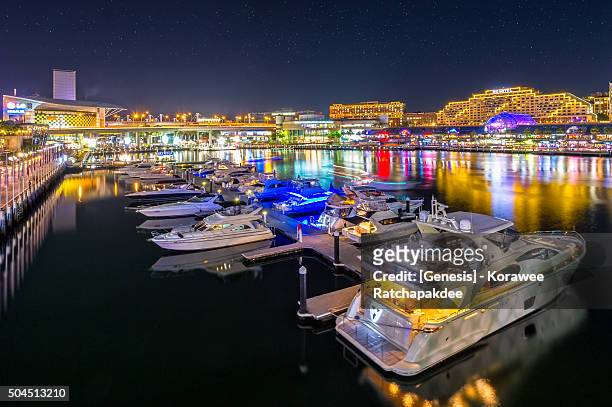 darling harbor in the night time - australia city scape light stock pictures, royalty-free photos & images
