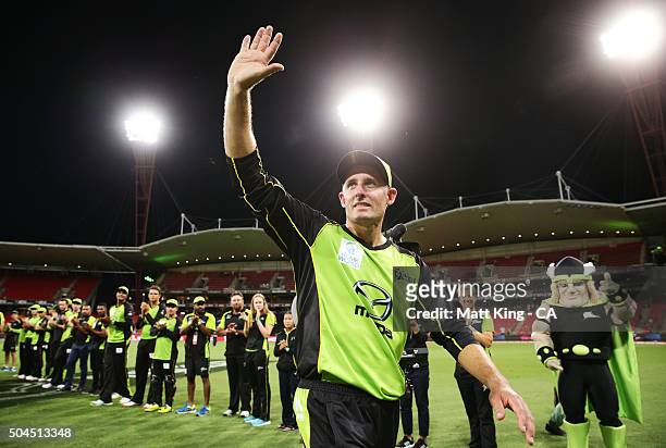 Thunder captain Michael Hussey acknowledges the crowd and walks through a guard of honour after playing his last home game after the Big Bash League...