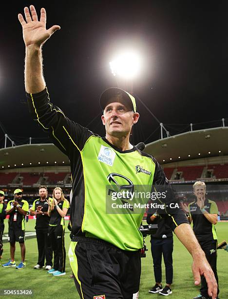 Thunder captain Michael Hussey acknowledges the crowd and walks through a guard of honour after playing his last home game after the Big Bash League...