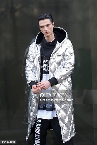 Model Vlad B wears a Vfiles coat, W.I.A tracksuit trousers and vest on day 3 of London Collections: Men on Januay 10, 2016 in London, England.