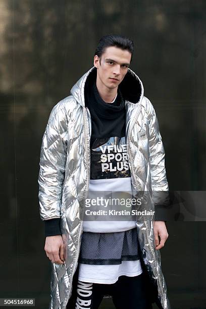 Model Vlad B wears a Vfiles coat, W.I.A tracksuit trousers and vest on day 3 of London Collections: Men on Januay 10, 2016 in London, England.