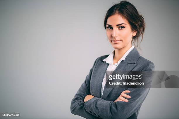 professional businesswoman - grey suit stock pictures, royalty-free photos & images