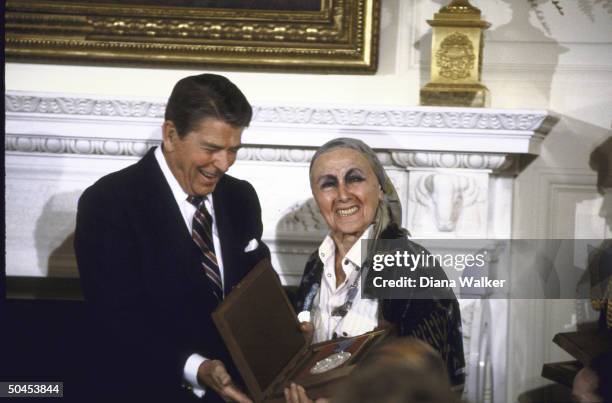 Sculptress Louise Nevelson being presented with National Medal of Arts by Pres. Ronald W. Reagan .