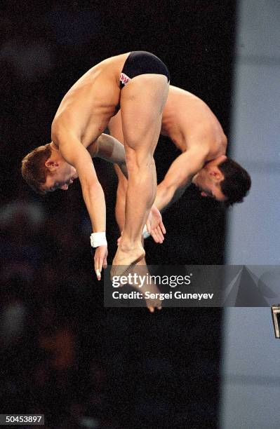 France's team in men's synchronized diving competition at Sydney International Aquatic Center during the Sydney 2000 Olympic Games.