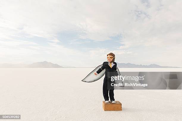 young boy businessman wearing cardboard wings - pre launch stock pictures, royalty-free photos & images