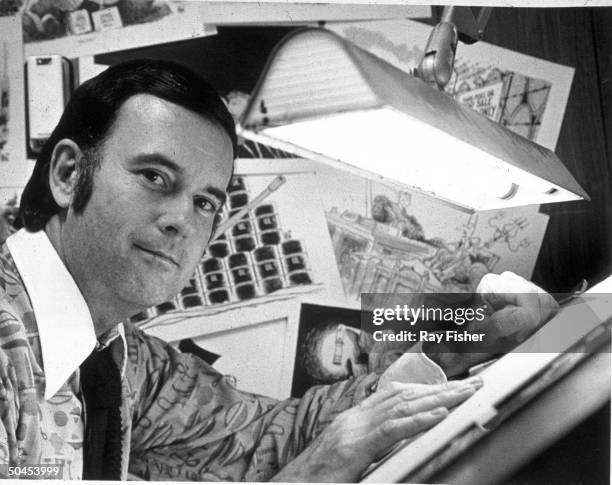 Political cartoonist Don Wright at his drawing board.