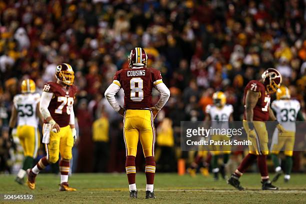 Quarterback Kirk Cousins of the Washington Redskins looks on against the Green Bay Packers at FedExField on January 10, 2016 in Landover, Maryland.