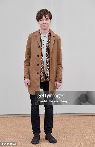 Alex Lawther attends the Burberry show during The London Collections Men AW16 at Kensington Gardens on January 11, 2016 in London, England.