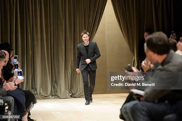 Christopher Bailey poses on the runway at the Burberry Menswear January 2016 Show on January 11, 2016 in London, United Kingdom.