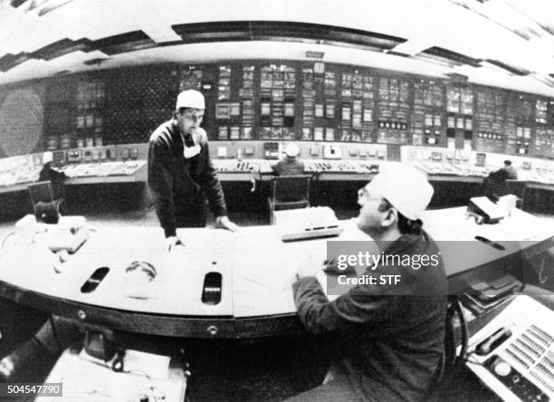 Picture taken 02 June 1986 at the control panel of the 1st power unit of Chernobyl nuclear plant of two technicians who worked at the reactor No 4...