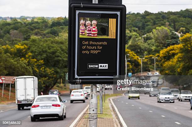 An advertisement for the Showmax video streaming service sits on the central reservation of a highway in Johannesburg, South Africa, on Monday, Jan....