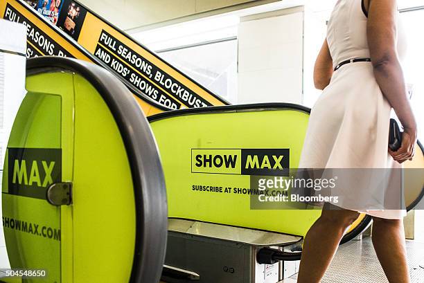 Advertisements for the Showmax video streaming service sit on escalators in the Sandton City shopping mall in Johannesburg, South Africa, on Monday,...