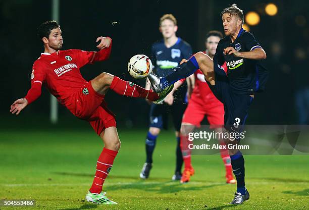 Leon Andreasen of Hannover is challenged by Per Skjelbred of Berlin during a friendly match between Hannover 96 and Hertha BSC Berlin at Cornelia...