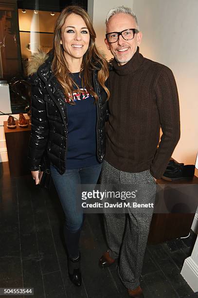 Elizabeth Hurley and Patrick Cox attend the LATHBRIDGE By Patrick Cox presentation during The London Collections Men AW16 on January 11, 2016 in...