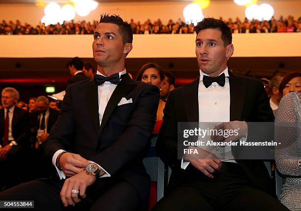 Ballon d'Or nominee Cristiano Ronaldo of Portugal and Real Madrid sits with FIFA Ballon d'Or nominee Lionel Messi of Argentina and Barcelona during...