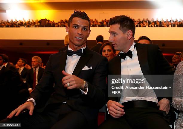 Ballon d'Or nominee Cristiano Ronaldo of Portugal and Real Madrid sits with FIFA Ballon d'Or nominee Lionel Messi of Argentina and Barcelona during...