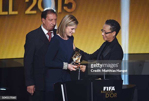 Jill Ellis, head coach of the United States women national football team receives the FIFA World Women's Coach of the Year Award from Hope Powell...