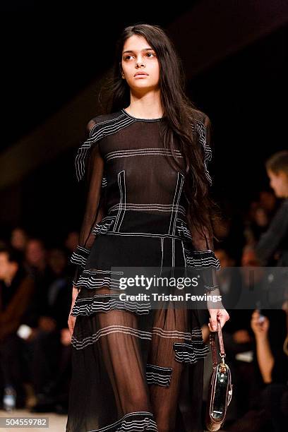 A model walks the runway at the Burberry show during The London Collections Men AW16 at Kensington Gardens on January 11, 2016 in London, England.