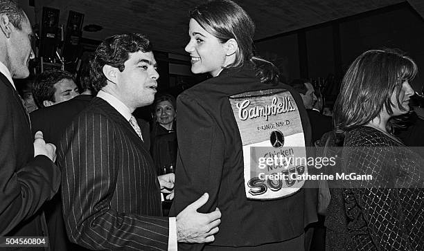 Woman wearing a jacket with a picture of a Campbell's Chicken Noodle Soup can sewn on the back attends the opening reception of the exhibit "The...