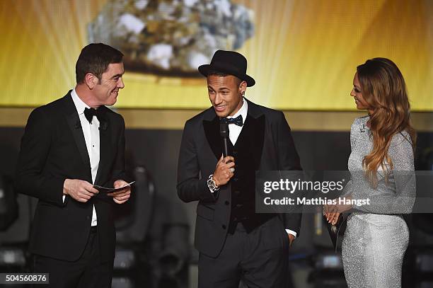 Neymar Jr of Brazil and FC Barcelona is interviewed by hosts James Nesbitt and Kate Adbo during the FIFA Ballon d'Or Gala 2015 at the Kongresshaus on...