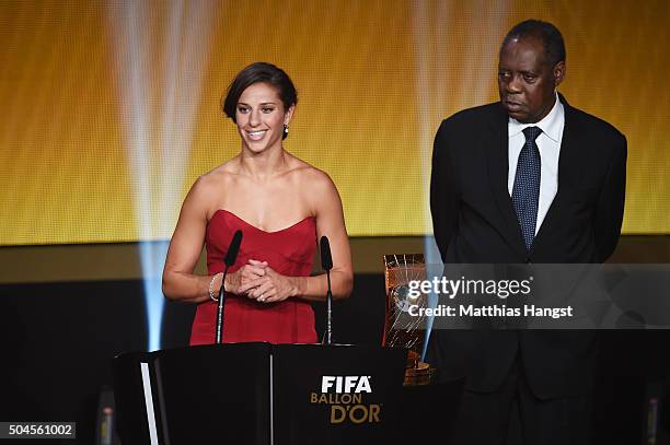 Carli Lloyd of USA and Houston Dash receives the during the FIFA Women's World Player of the Year Award from Acting FIFA President Issa Hayatou FIFA...